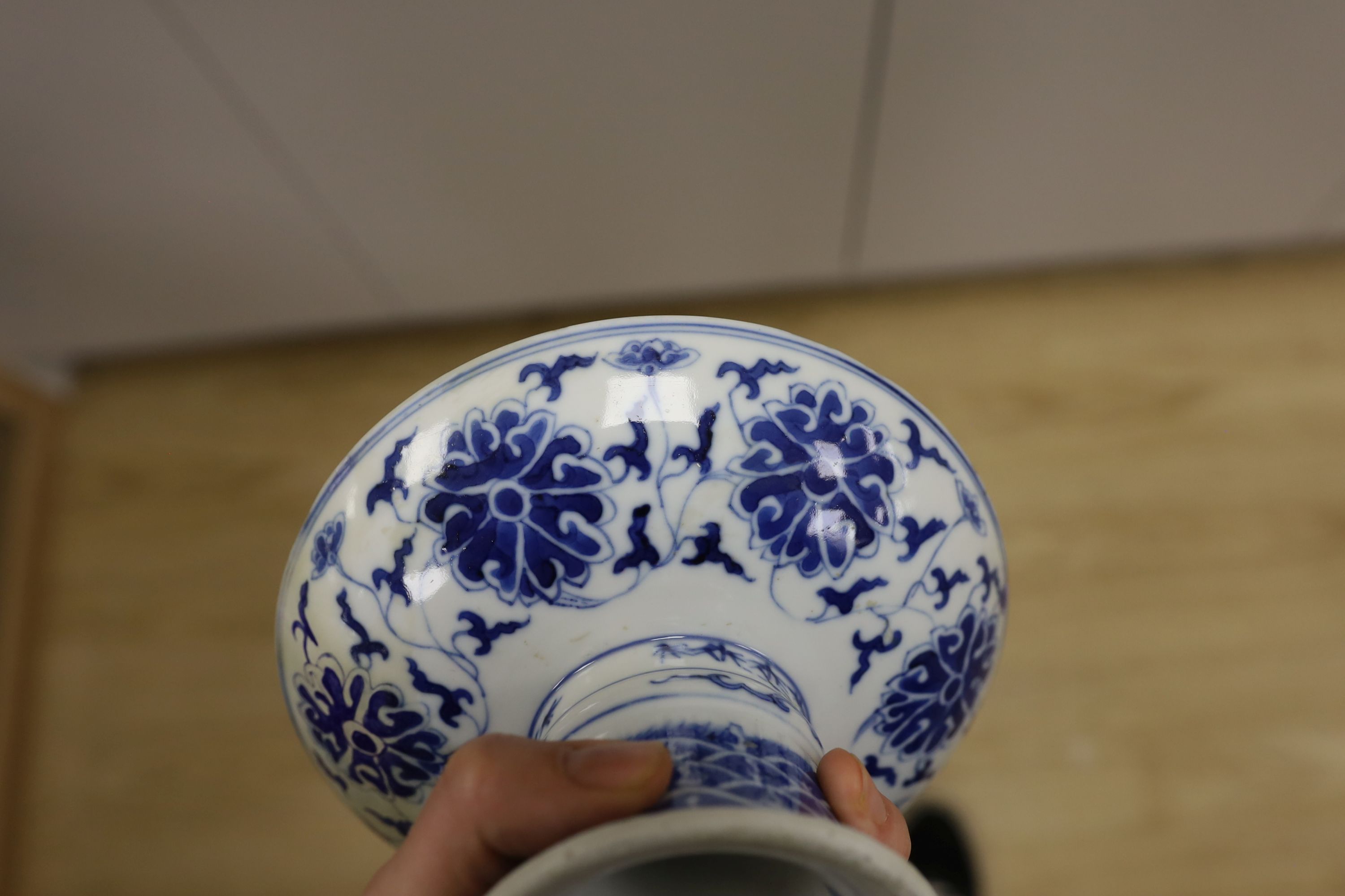 A Chinese underglaze copper red ‘herder and goats’ vase, Kangxi six character mark but Republic period and a Chinese blue and white lotus stem dish, six character Guangxu mark and period, both damaged